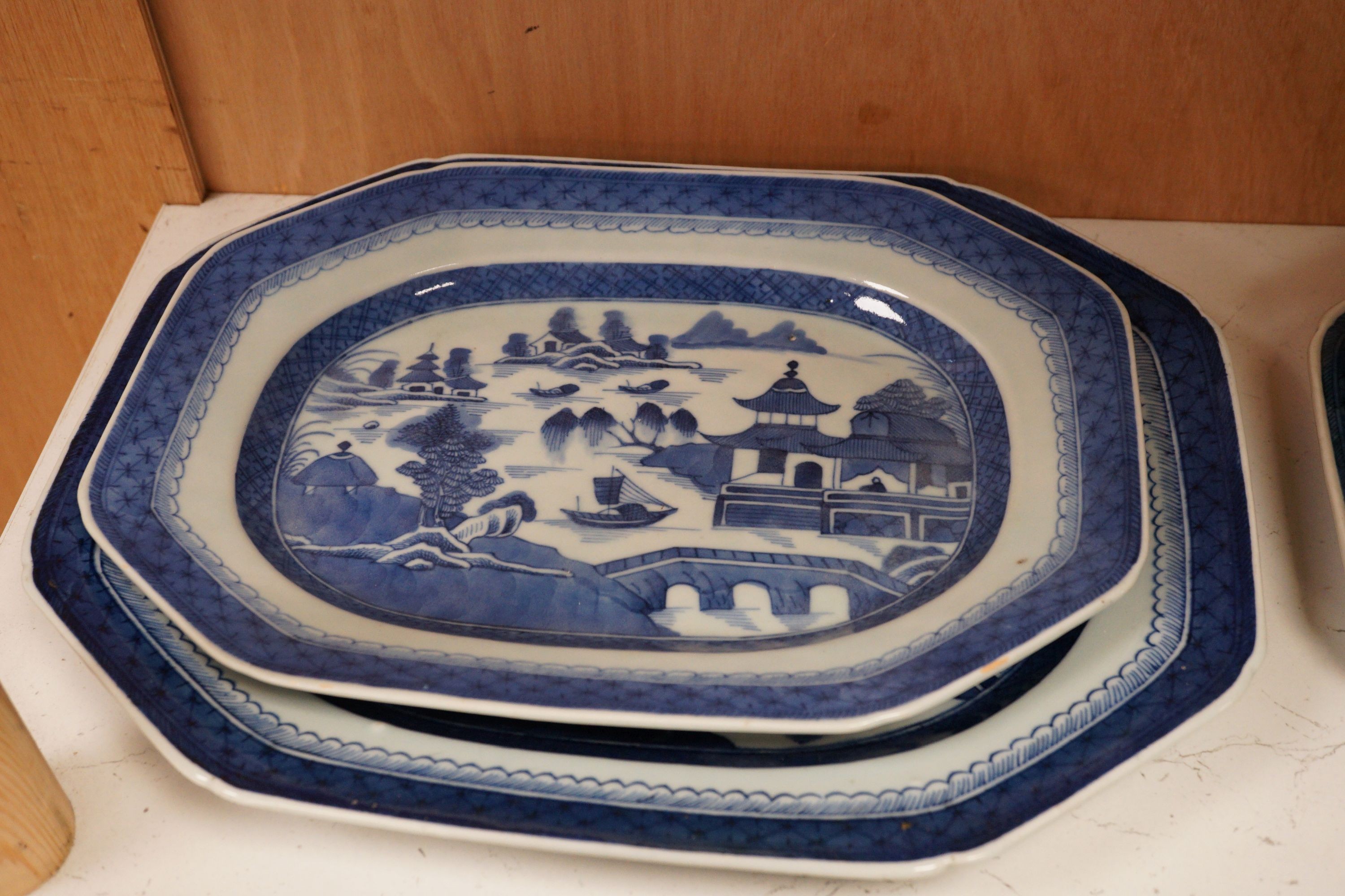 A group of Chinese blue and white porcelain, early 19th century, to include five graduated trays, and two tureens
